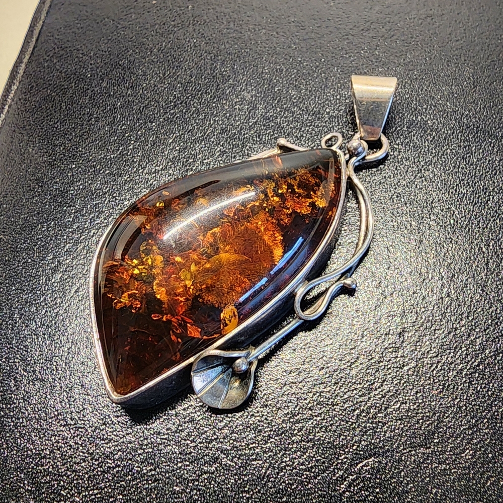 Elegant Amber Pendant with Silver Accents